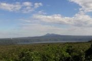 Masaya Lagoon surrounded by volcanic landscape and dry forest